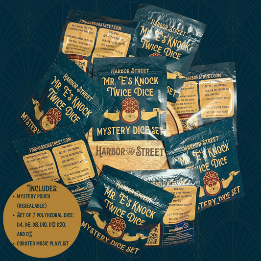 Pile of Mr. E's Knock Twice Dice mystery dice set pouches.