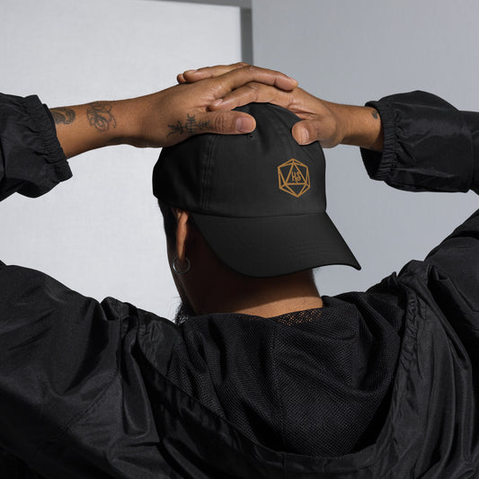 Black dad hat with Harbor Street D20 gold embroidered logo on model